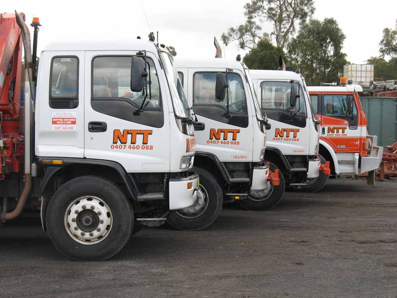line of flatbed trucks