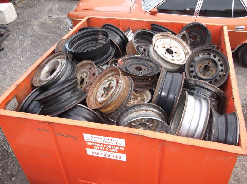 bin full of old metal wheels