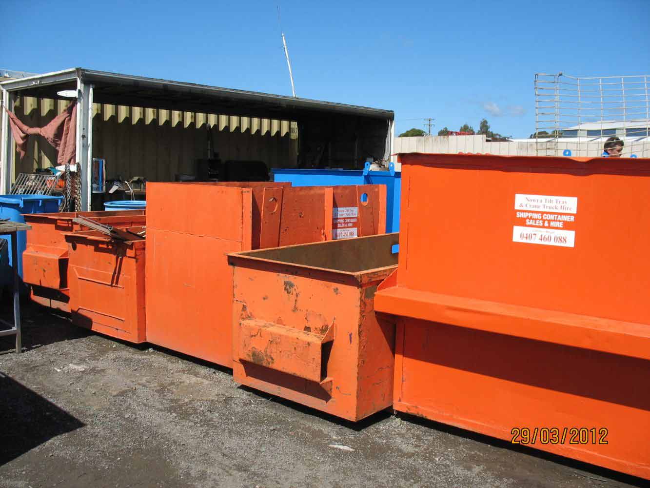 orange dumpster and containers