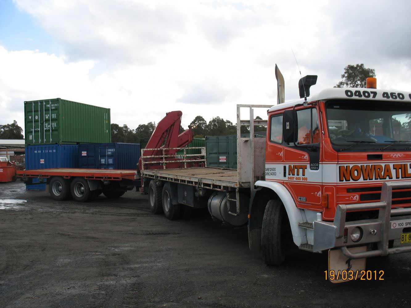 flat bed truck pulling flat bed trailer