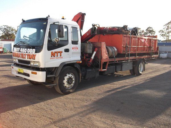 flatbed with loaded orange bin