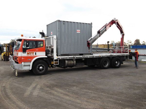 loading truck with grey container