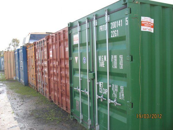 containers in green red yellow and blue