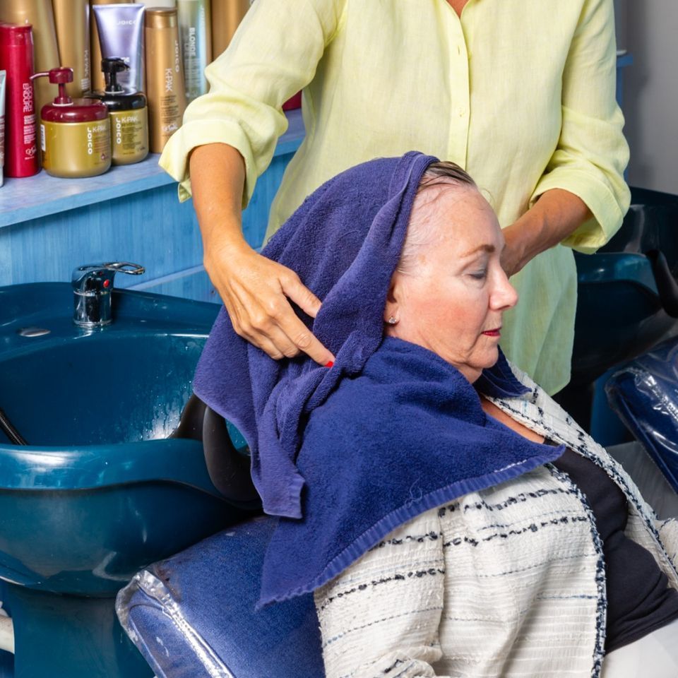 Drying Out Customer Hair — Fort Myers, FL — Rumours Hair Design