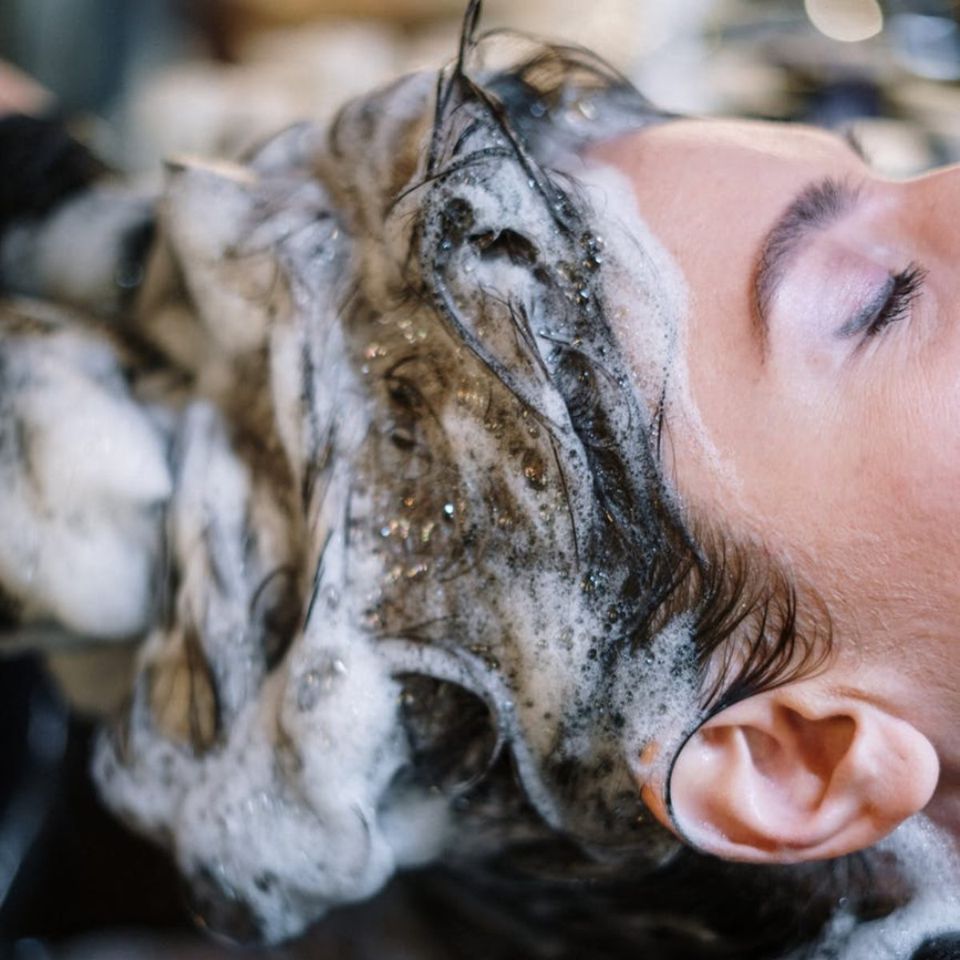 Customer Head with Shampoo — Fort Myers, FL — Rumours Hair Design