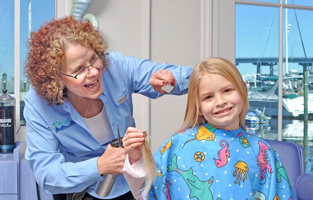 Kid Having Haircut — Fort Myers, FL — Rumours Hair Design