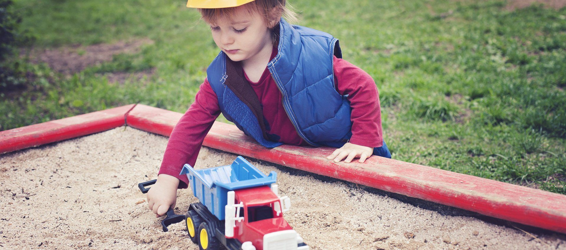 boy playing in mud