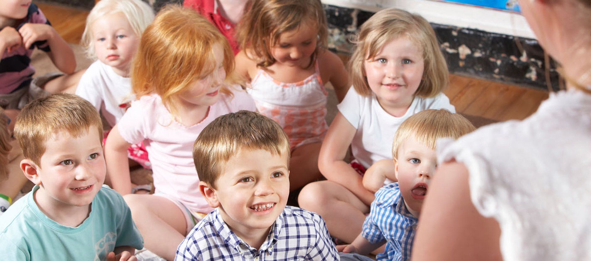 Kids listening to their teacher