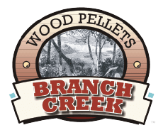 A logo for wood pellets branch creek with trees in the background