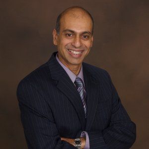 Smiling Client Arun DeSouza
