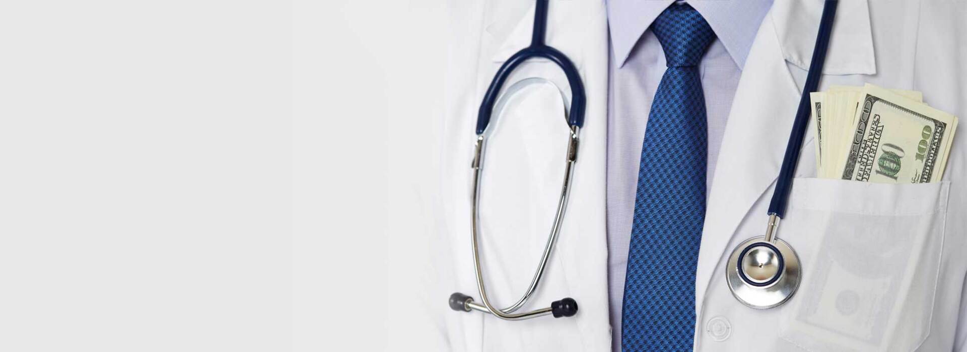 Doctor with stethoscope around neck and 100 dollar bills in his pocket
