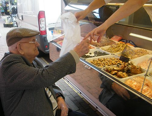 Old man buying food 