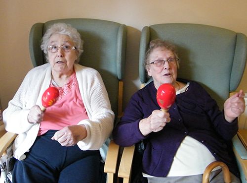 Elderly ladies having fun in the care home