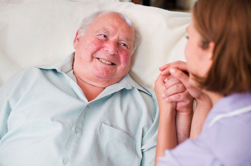 Care Giver at Home of Elderly Man
