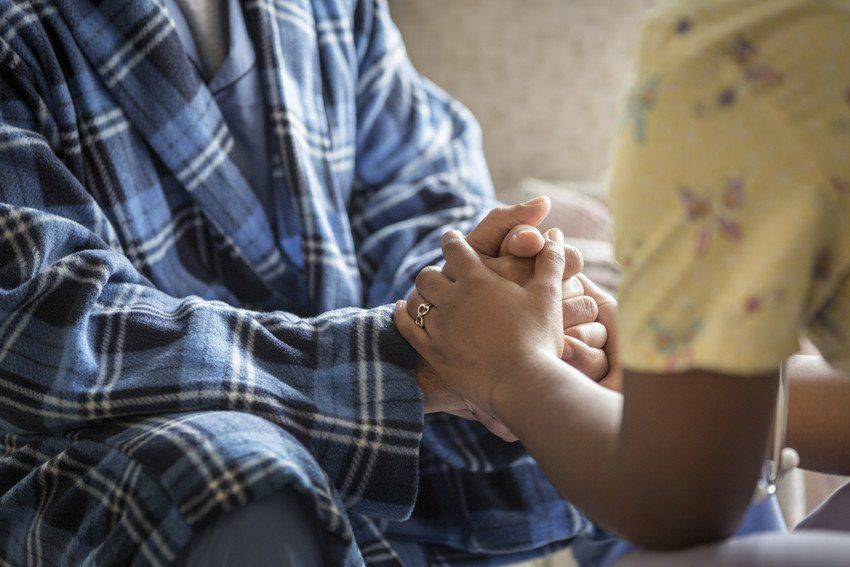 caring with warm hands for elder