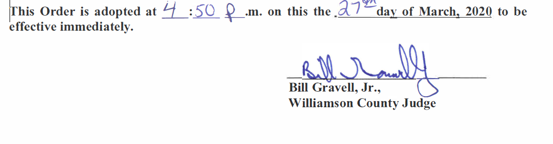 A person 's signature is on a piece of paper.