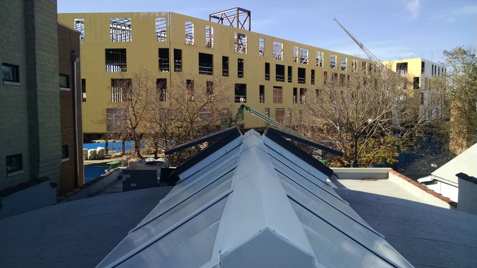 A building under construction with a pyramid shaped roof