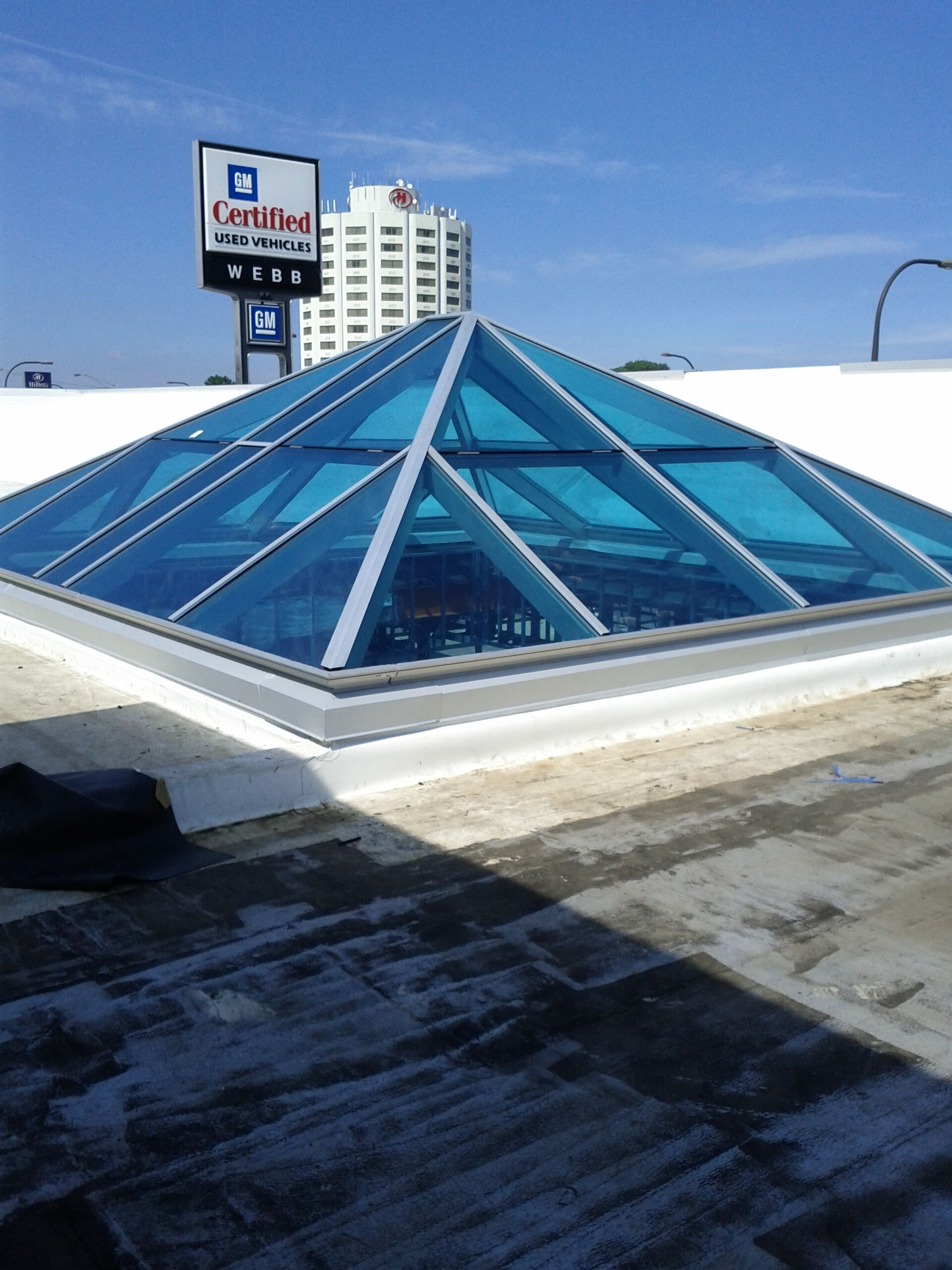 A pyramid shaped skylight on the roof of a building