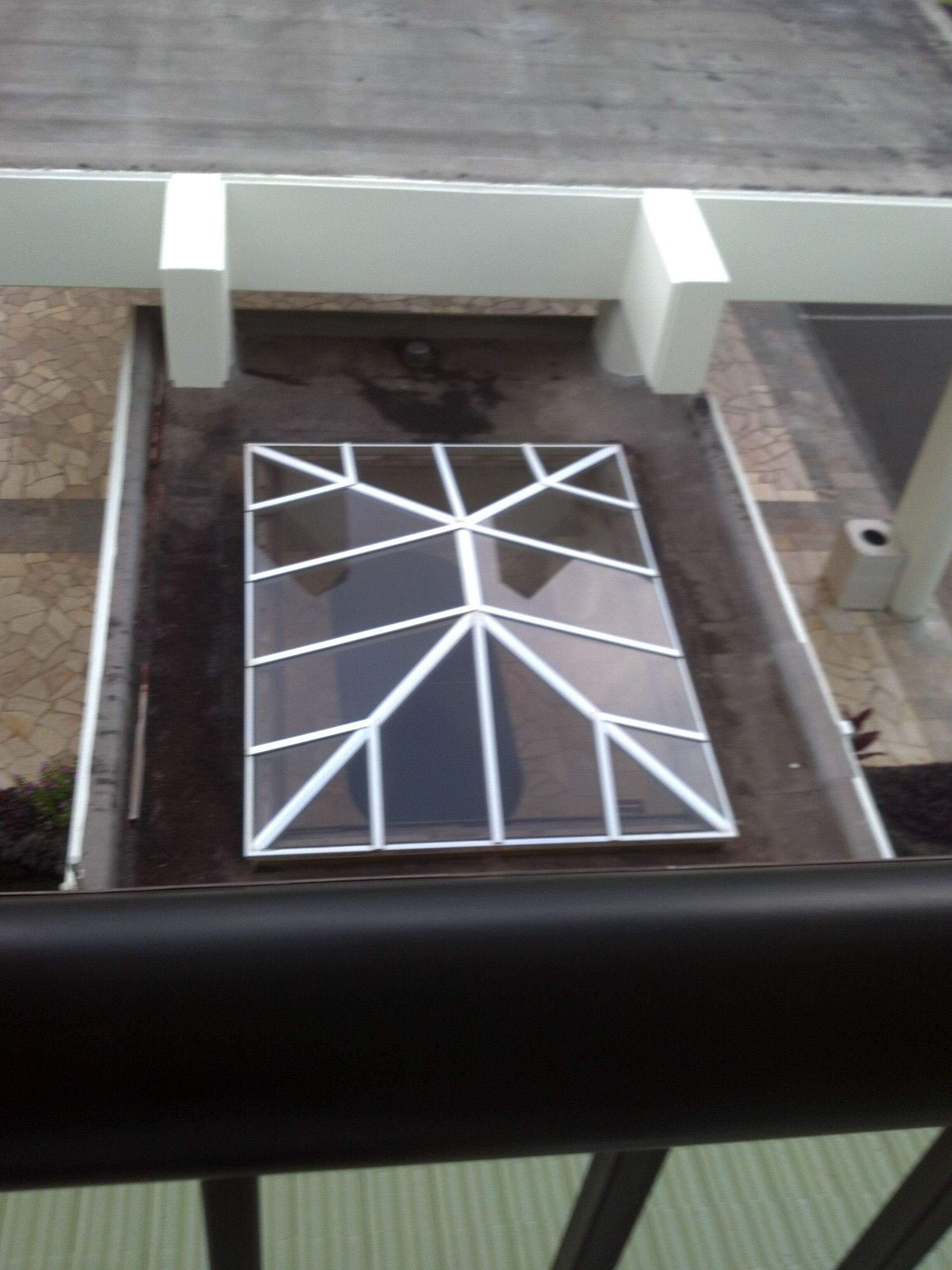 An aerial view of a skylight on the roof of a building