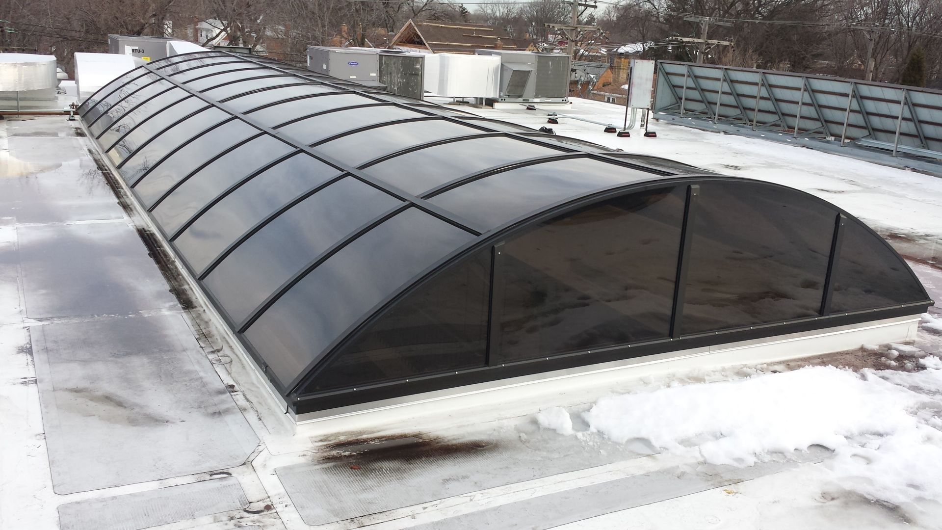 A roof with a dome shaped covering on it