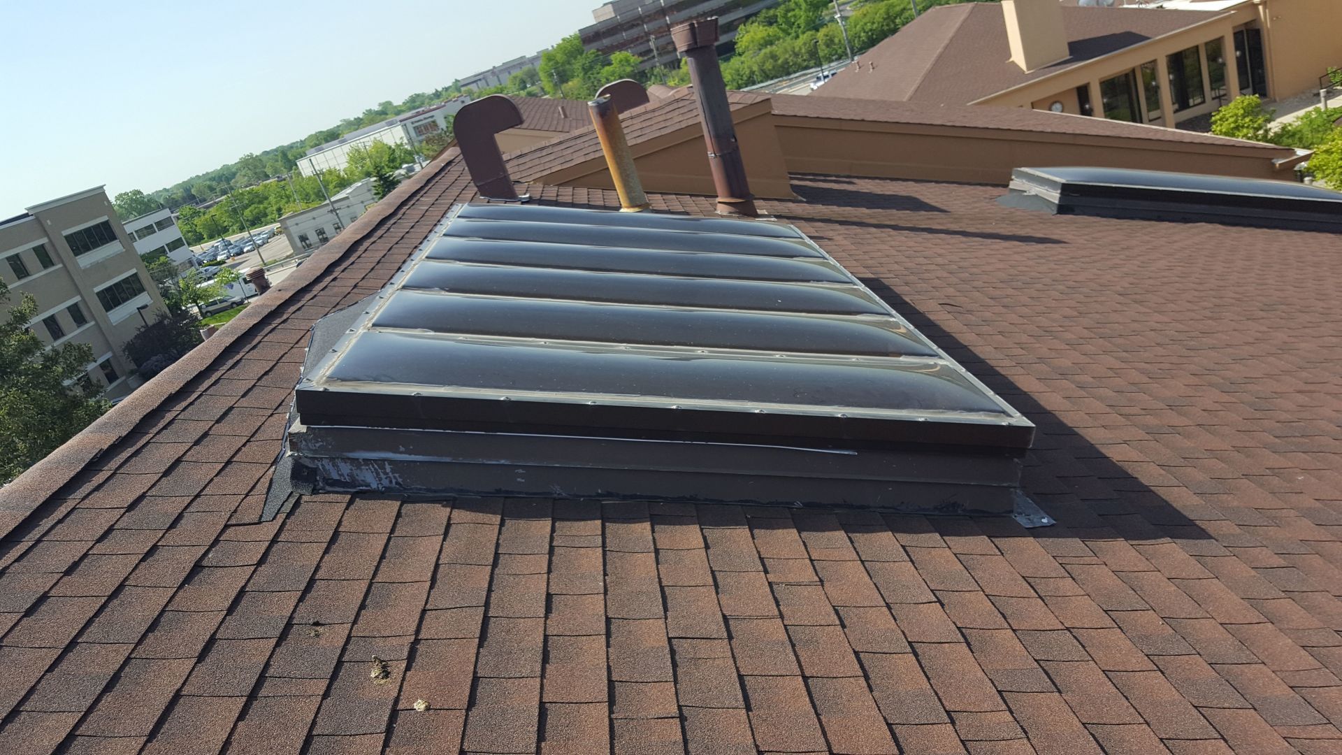 A roof with a skylight on top of it
