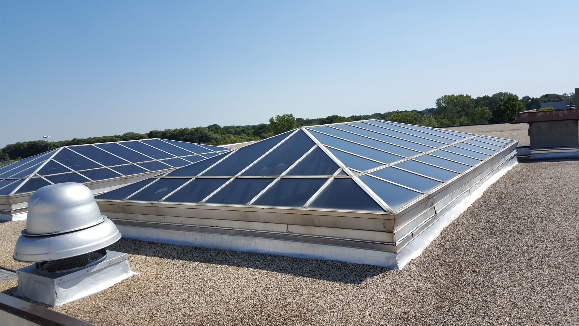 A roof with a lot of skylights on it