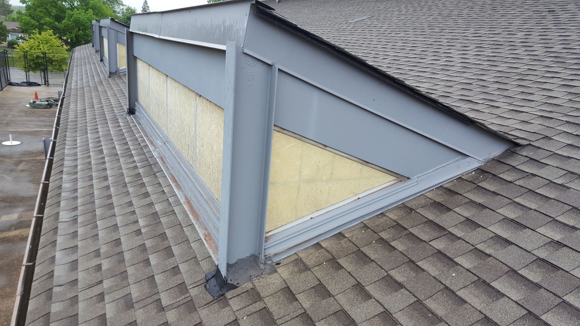 A roof with a window in the middle of it