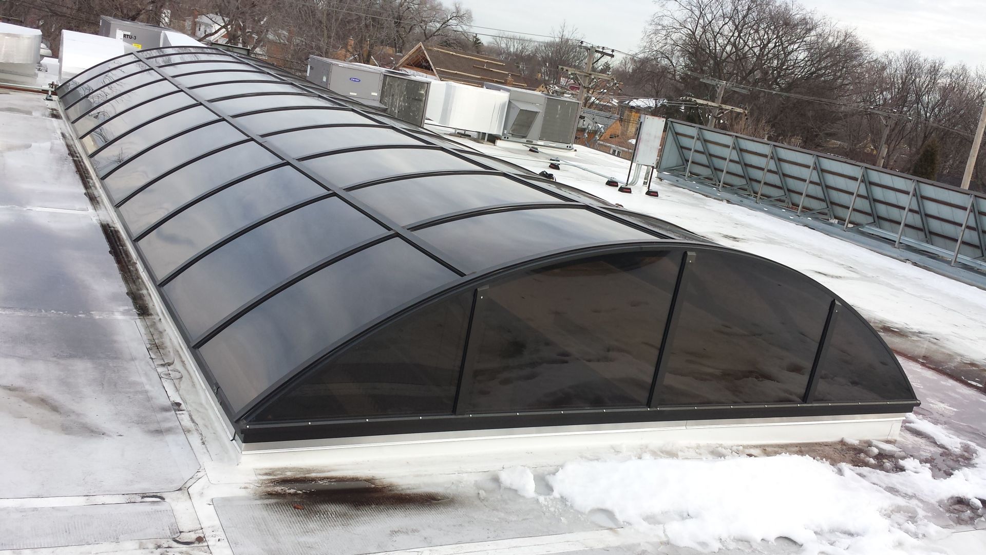 The roof of a building with a black roof