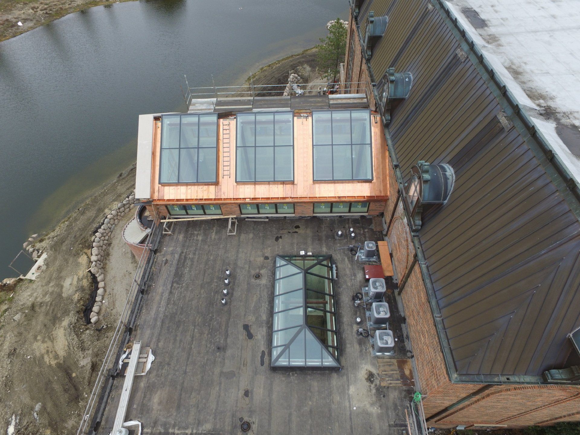 An aerial view of a building with a large glass roof