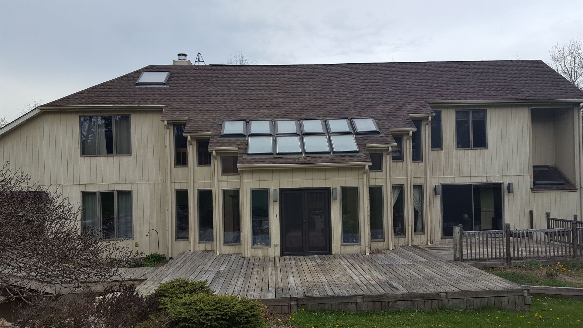 A large house with a roof that has solar panels on it.