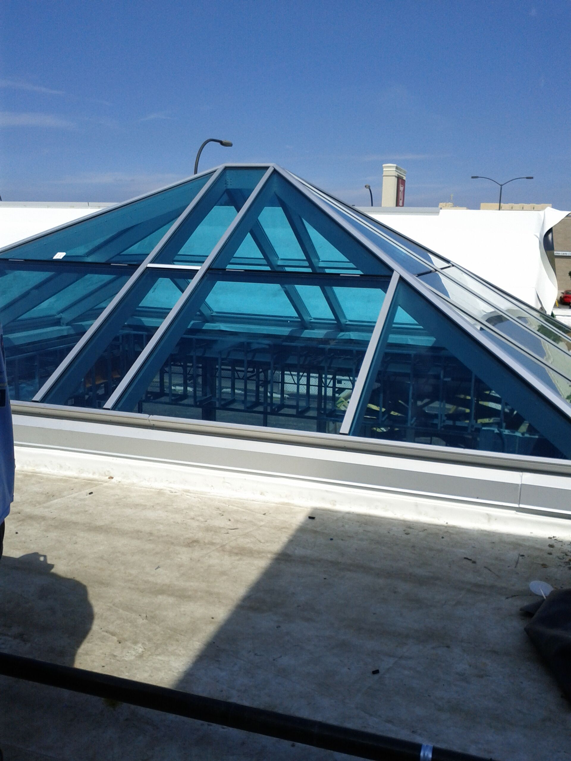 A pyramid shaped skylight on the roof of a building