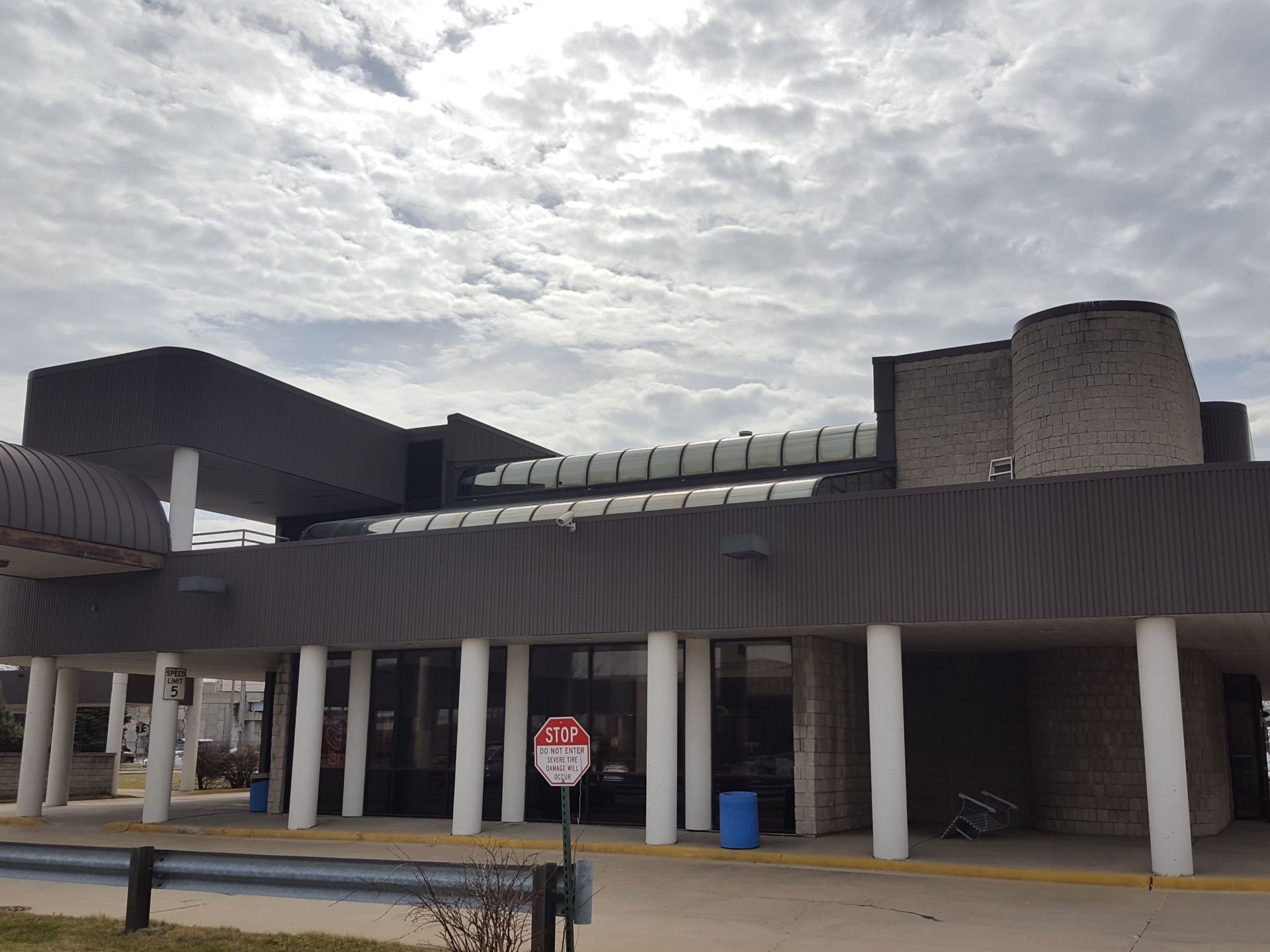 A large building with a stop sign in front of it