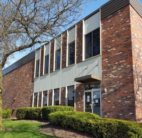 A large brick building with the number 308 on it