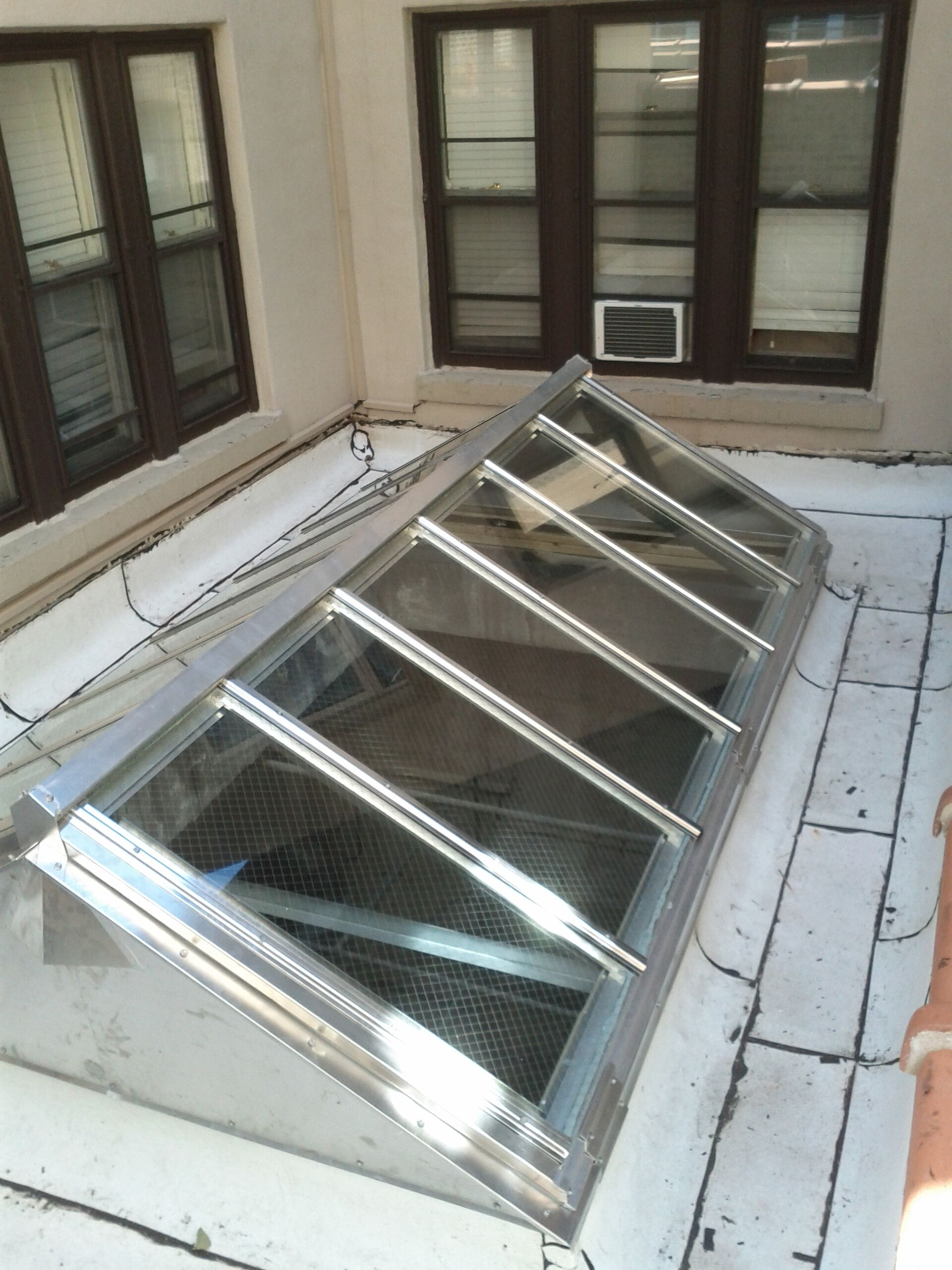 A stainless steel skylight on the roof of a building