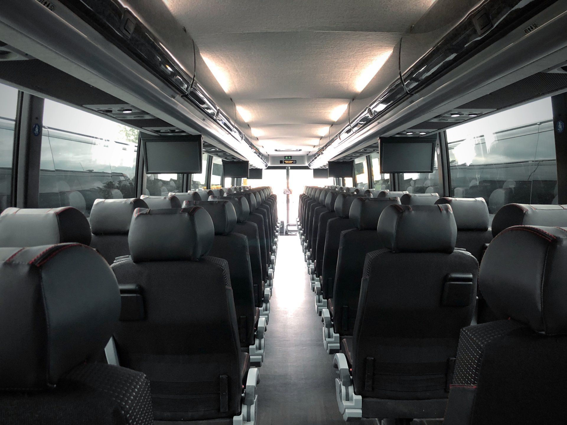 The inside of a bus with a lot of seats