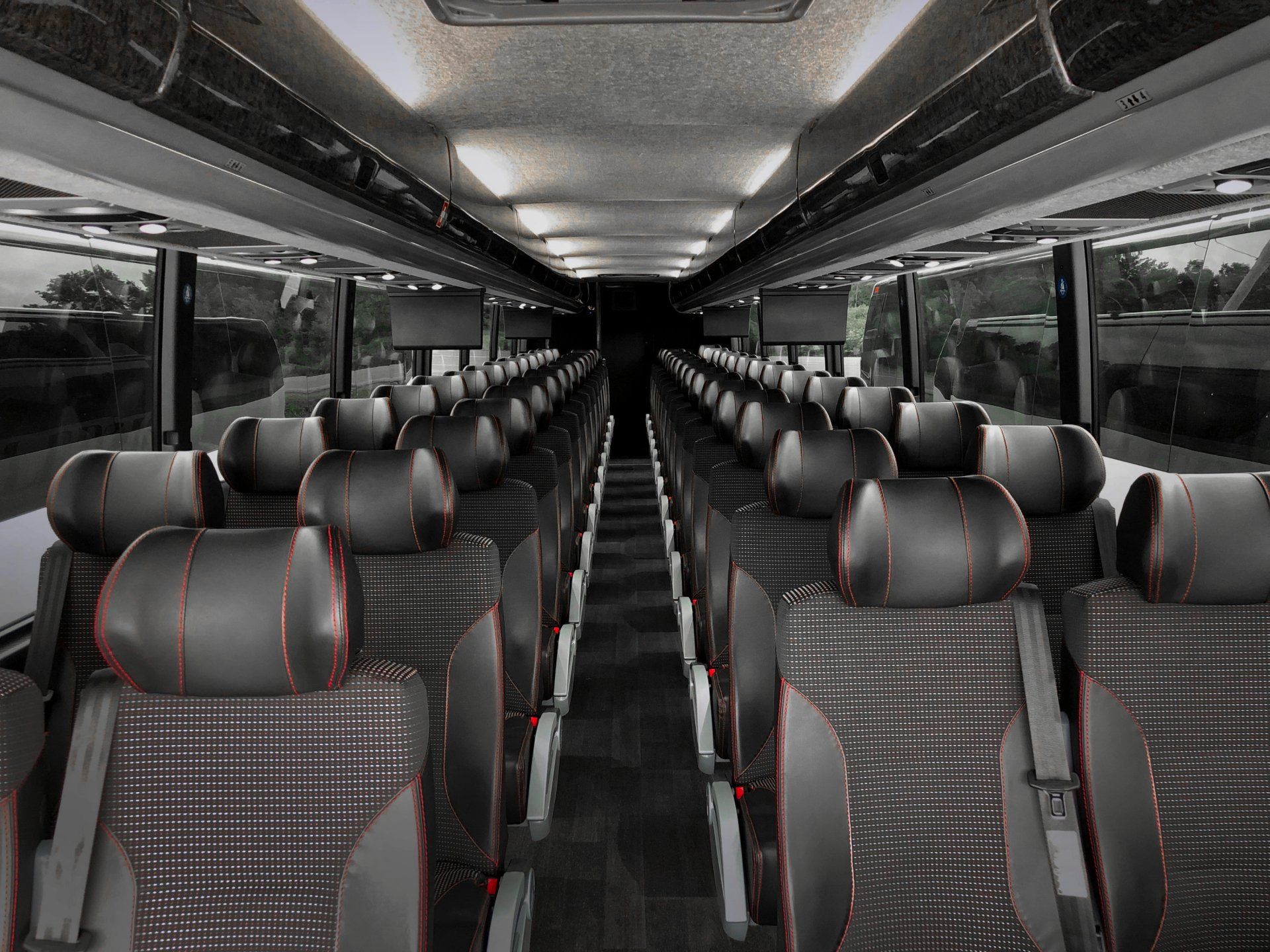 A black and white photo of the inside of a bus.