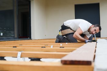 Lumber — Carpenter Installing a Wood Floor Outdoor Terrace in Oaklyn, NJ Lumber — Carpenter Installing a Wood Floor Outdoor Terrace in Oaklyn, NJ