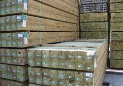 Treated Lumber — Applying Protective Varnish on a Wooden Texture, Diy and Repair House Equipment Concept in Oaklyn, NJ Treated Lumber — Applying Protective Varnish on a Wooden Texture, Diy and Repair House Equipment Concept in Oaklyn, NJ