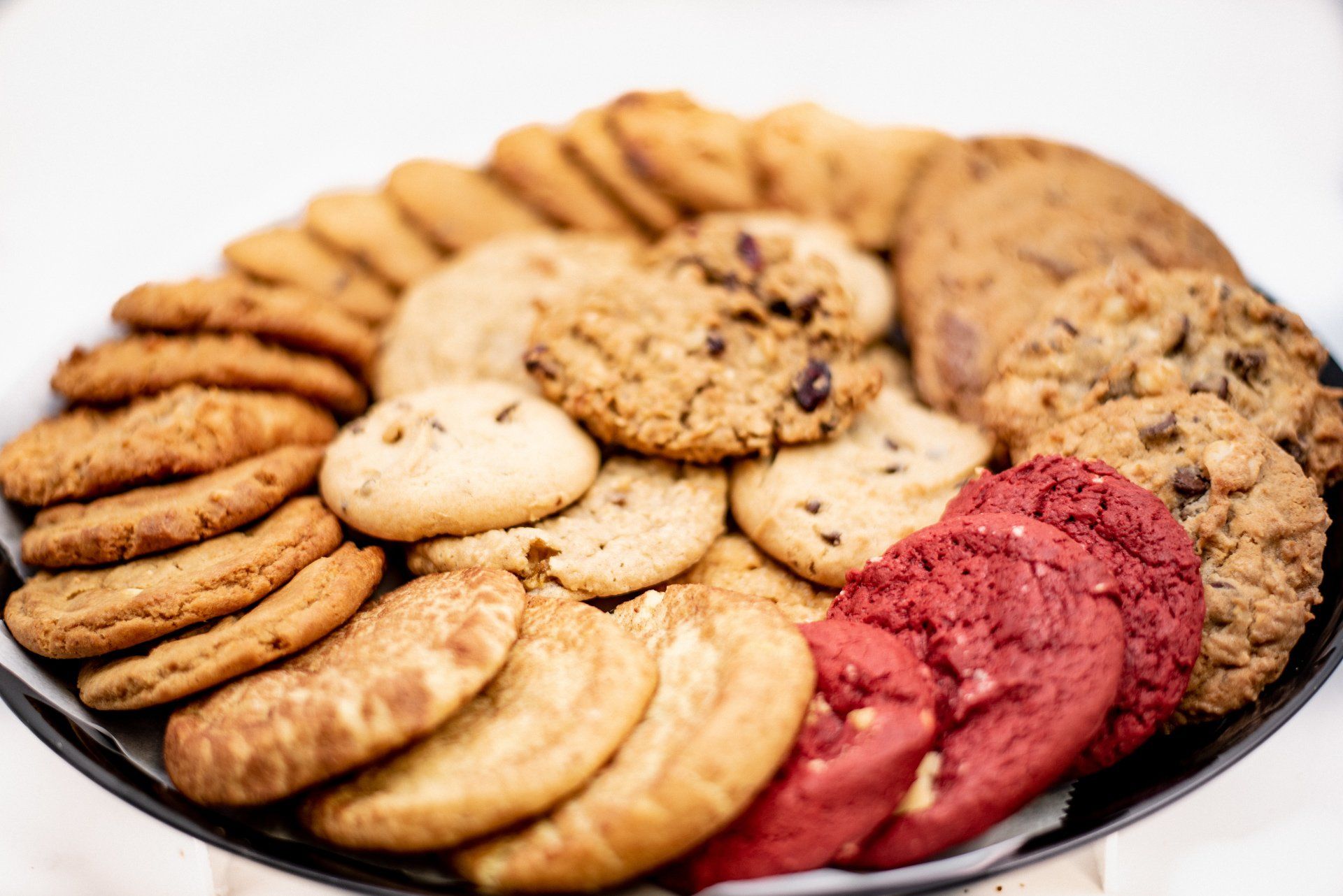 There are many different types of cookies on the plate.
