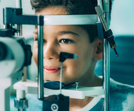 Contacts — Ophthalmologist examining boy's eyes in Highland, IN Contacts — Ophthalmologist examining boy's eyes in Highland, IN