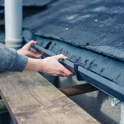 Gutter Maintenance — Man Repairing Gutter in Cottage Grove, OR Gutter Maintenance — Man Repairing Gutter in Cottage Grove, OR