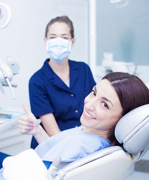 Woman Taking Dental Treatment — Bloomingdale, IL — Dr Boyer & Scheive, DDS Woman Taking Dental Treatment — Bloomingdale, IL — Dr Boyer & Scheive, DDS