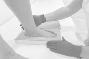 Foot being fitted for orthotic