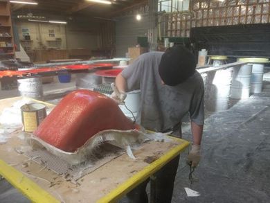Man repairing fibreglass boat