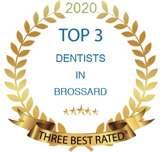 A gold laurel wreath that says top 3 dentists in brossard