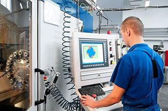 mechanical technician operative of cnc milling cutting machine center at tool workshop