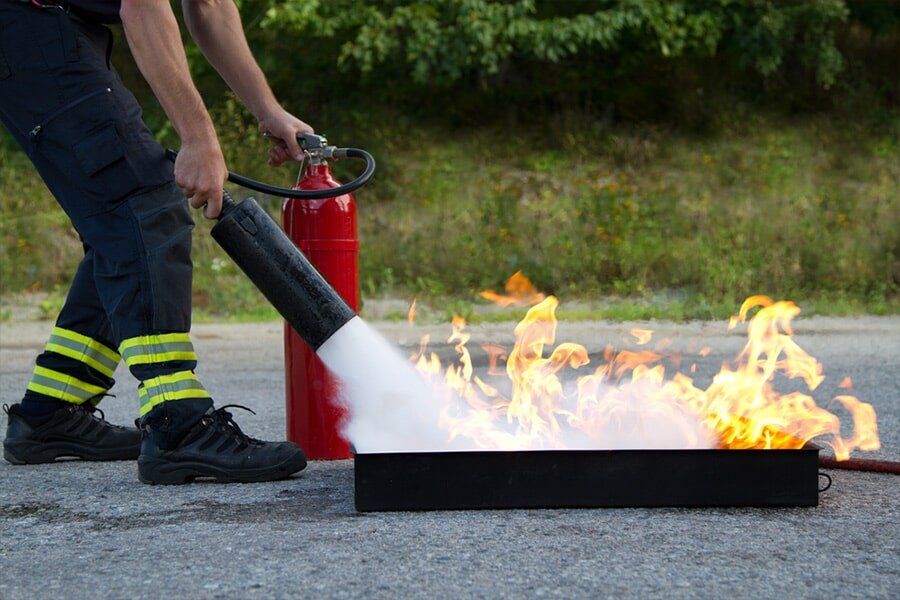 Fire Extinguisher Demonstration — East-West Fire Services In Garbutt, QLD