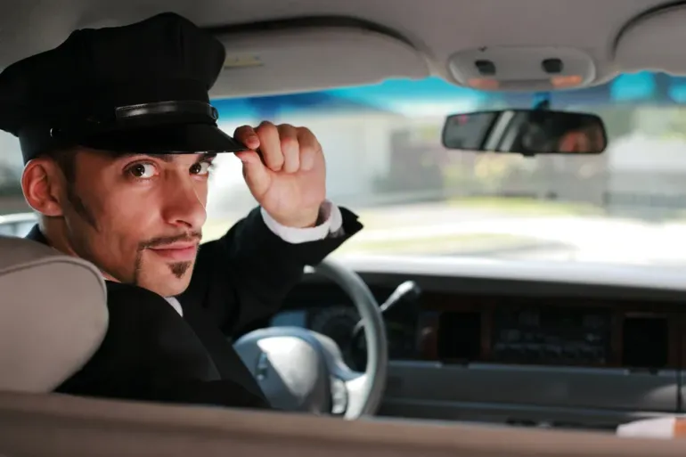 Limousine Driver Holding His Cap — Ceres, CA — Luxury Limousine Limousine Driver Holding His Cap — Ceres, CA — Luxury Limousine