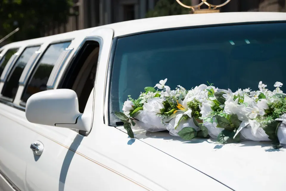 White Wedding Limo with Flowers — Ceres, CA — Luxury Limousine White Wedding Limo with Flowers — Ceres, CA — Luxury Limousine