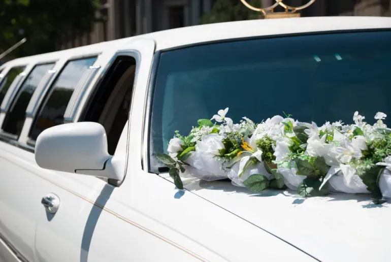 White Wedding Limo with Flowers — Ceres, CA — Luxury Limousine White Wedding Limo with Flowers — Ceres, CA — Luxury Limousine